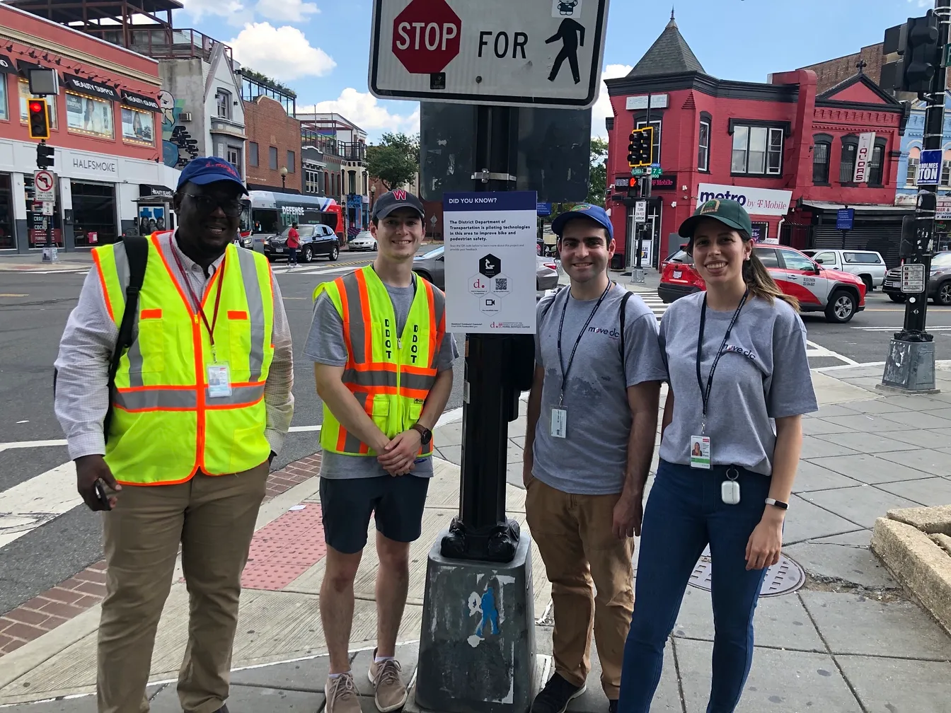 Staff from DDOT out engaging residents about the technologies being piloted using one of the DTPR signs