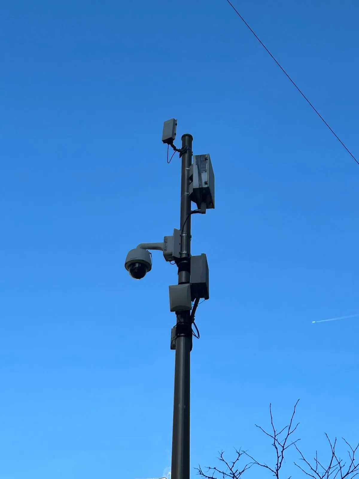Photo of a pole in Downtown Brooklyn with various technologies attached